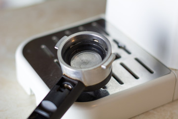 White coffee machine and a horn on the table. Professional coffee brewing at home