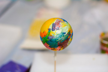 Christmas ball abstractly painted in the workshop