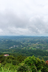 Obraz premium beautiful blue sky high peak mountains mist fog wildlife green forest at Khao Koh, Phu Tub Berk, Phetchabun, Thailand guiding idea long weekend for backpacker camping campfire relaxing hiking
