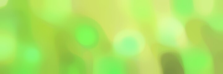 blurred bokeh horizontal background with yellow green, moderate green and khaki colors space for text or image