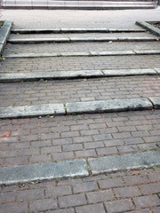 old staircase paved with red pavers