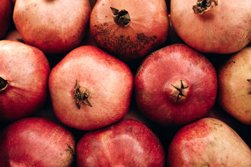 Tasty ripe fresh pomegranates background. Useful vitamins food.