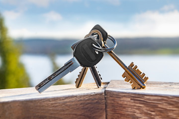 Various keys with ring on a wooden board