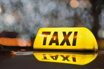 Yellow taxi sign