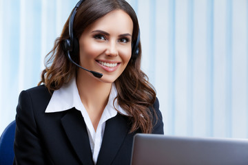 Portrait picture of customer support female phone operator or sales agent in headset and confident...