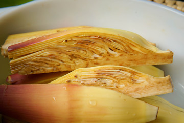 banana blossom with slice on plate.
