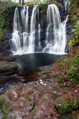 Obraz premium forest waterfall and rocks covered with moss Northen Ireland