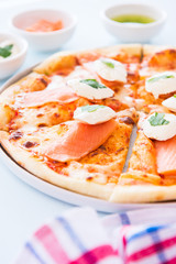 Homemade pizza with salmon fish and cream cheese - Plaisir.
