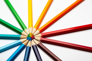 Colorful wooden pencils on a white background