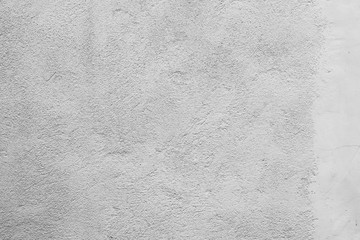 Texture of a concrete wall with cracks and scratches which can be used as a background