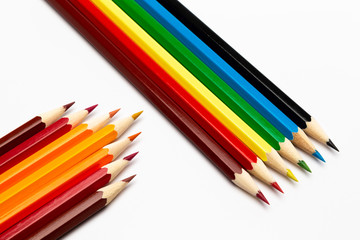 Colorful wooden pencils on a white background