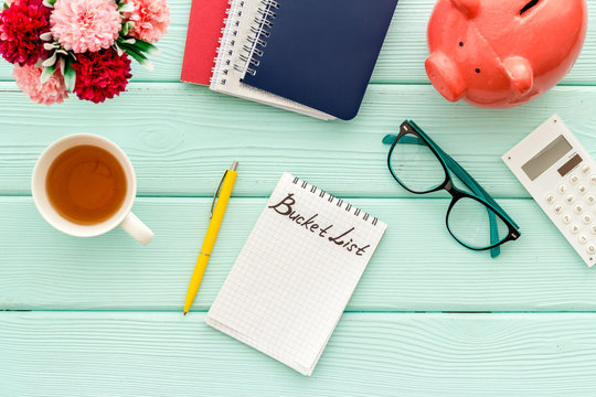 Bucket List. Blank Notebook To Write Goals And Wishes On Green Wooden Office Desk Top-down