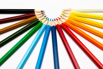 Colorful wooden pencils on a white background