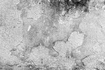 Texture of a concrete wall with cracks and scratches which can be used as a background