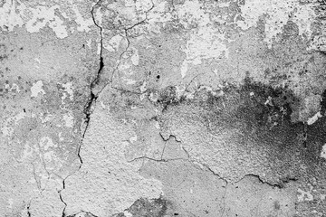 Texture of a concrete wall with cracks and scratches which can be used as a background