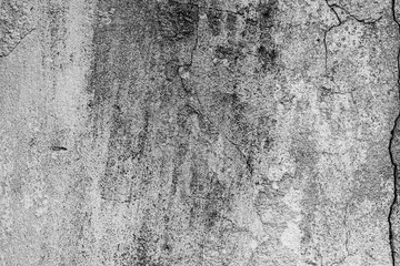 Fototapeta premium Texture of a concrete wall with cracks and scratches which can be used as a background