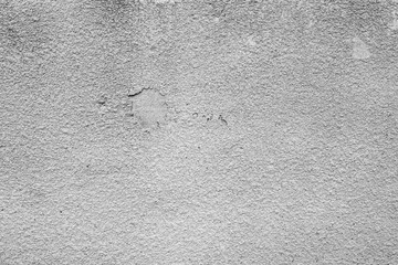 Texture of a concrete wall with cracks and scratches which can be used as a background