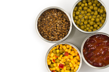 Canned food on white background. Green pea, beans, corn, lentils.