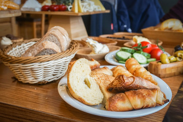 close up selective focus Turkish traditional breakfast of baked bread with vegetable and cheese