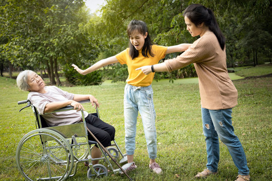 Unhappy Asian Teen Granddaughter Set Apart,dissuade Her Family,angry Senior Mother And Aggressive Daughter Arguing Violently,shouting Quarreling At Park,ungrateful,family Relations, Family Problems