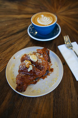Cup of coffee latte art with coffee shop.