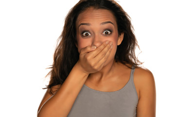Fototapeta premium portrait of young shocked woman on white background
