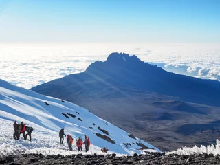 Acrylic prints Kilimanjaro hikers on the ridge ascend mount kilimanjaro the tallest peak in africa.