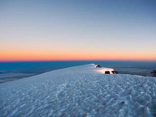 hikers on the ridge ascend mount kilimanjaro the tallest peak in africa.