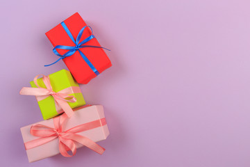 Different colored gift box on color background. Top view of various present boxes on minimal background. Birthday, Christmas, wedding, valentine, romantic gifts - Image