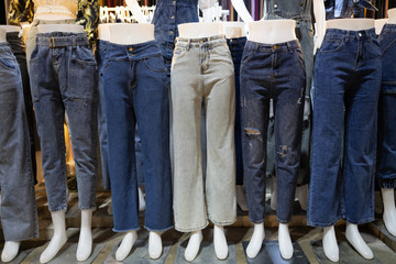 Collection of various types of blue jeans trousers,set of female mannequin in legs of women’s...