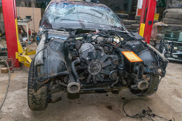 Semi-disassembled car after an accident close-up on the auto Assembly. Concept of car service, auto...