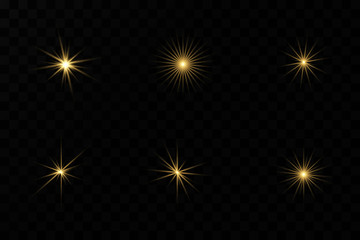 Set of flashes, Lights and Sparkles on a transparent background. Bright gold flashes and glares. Abstract golden lights isolated Bright rays of light.