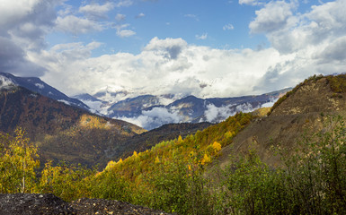 Mountain  slopes covered with forests and low thunderclouds in Svaneti in the mountainous part of Georgia