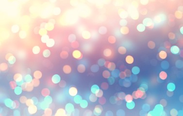 Golden sparkles on blue pink yellow iridescent blurry background. Bokeh abstract gradient pattern. Glitter defocus texture. New year festive empty template. 