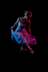 girl in a dress. color portrait ballerina dancing. dancer in motion with the effects of highlighting with color filters in the fog on a black background. Abstract photo in color light   