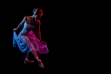 color portrait ballerina dancing. dancer in motion with the effects of highlighting with color...