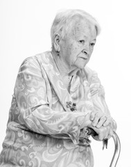 Portrait of pensive old woman posing in studio