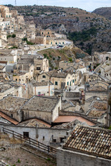 Obraz premium View of the Sassi di Matera a historic district in the city of Matera, well-known for their ancient cave dwellings. Basilicata. Italy
