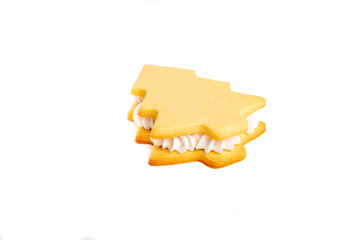 Baking cookies Christmas tree sandwich on a white plate with cream