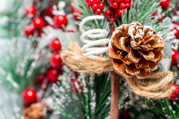 Christmas tree branch with red berries macro