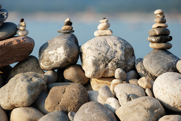 on the big rocks stands a small pebble beach summer day