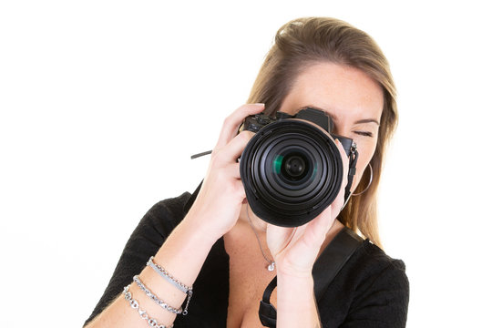 Cute woman photographer taking photos with dslr camera photography
