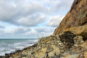 natural stone shelter on the beach under a rock