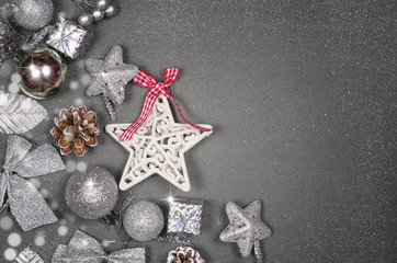 Obraz na płótnie Canvas Christmas composition. Silver xmas decoration on gray background. Flat lay, top view, copy space