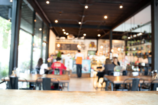 Blurred Background Barista Service Customers At Counter In Coffee Shop Business Concept.