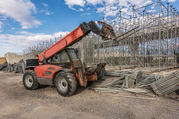 Fototapeta premium Forklifts in a construction site performing an overpass in the construction of a road