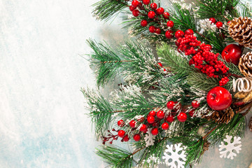Obraz na płótnie Canvas snow-covered Christmas fir branches on a blue background
