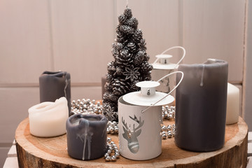 Candles, candlesticks and Christmas tree. Christmas home decoration.
