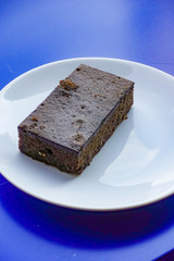 Fototapeta na wymiar Delicious dark chocolate fudge on white plate