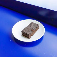 Delicious dark chocolate fudge on white plate